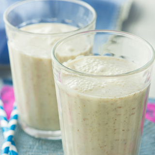 2 glasses filled with vanilla muesli milkshake